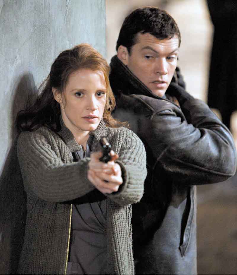 Jessica Chastain (left) and Sam Worthington (right) star in John Madden’s espionage thriller THE DEBT, a Focus Features release.
