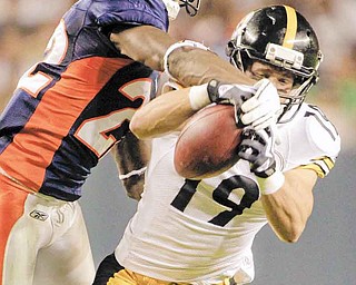 Denver Broncos cornerback Alphonso Smith (22) breaks up a pass intended for Pittsburgh Steelers wide receiver Tyler Grisham (19) during the second half of a preseason NFL football game Sunday, Aug. 29, 2010, in Denver. (AP Photo/Jack Dempsey)