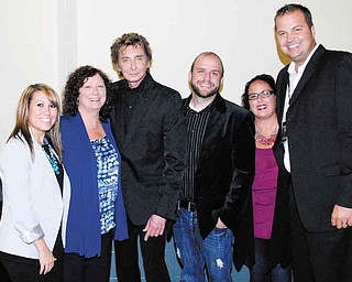 Barry Manilow, third from left, met with Covelli Centre officials after his concert at the Youngstown venue. Pictured are, from left, Kelsey Rupert, director of sales and marketing; Susan Jacobson, director of finance; Manilow; Ken Bigley, assistant director; Tracy Biery, box-office manager; and Eric Ryan, executive director.