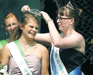 Melissa Moliterno, 17, left, the 2011 Junior Fair queen, gets her tiara from last year’s queen DeLorean Jones of Austintown. Melissa, of Canfield, received the honor Thursday at the Canfield Fair’s annual Youth Day Royal Court ceremony.