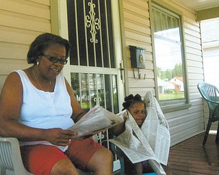 Donna Clayton of Youngstown reads the newspaper to her granddaughter, Saria Drake of Youngstown. Donna's daughter, Darlene Drake of Youngstown, who submitted the photo, says, her very patient mom takes care of the energetic, inquisitive and humorous Saria, who is 3 years and 7 months old.