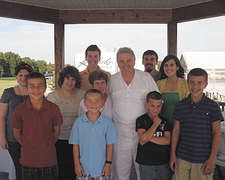 Cosmo and Frances Pecchia are pictured with their nine grandchildren during their 50th anniversary party recently at Mastopietro's Winery. Their anniversary is Sept. 16. Photo submitted by David S. Pecchia.