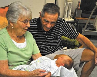 Great-grandparents Don and Bev Kuhns of Greenford meet their first great-granddaughter, Naomi Lane of Wahalding, Ohio, for the very first time!