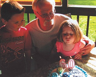 Grandpa Bruce Geilhard of Vienna celebrates his 60th birthday in June with grandchildren Logan and Sara Geilhard of Mecca.
