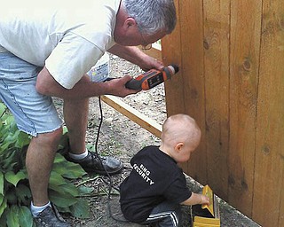Ron Diefenderfer of Austintown receives help from grandson Evan Diefenderfer of Canfield. Photo was submitted by Trish Diefenderfer.