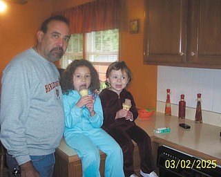 Aubin Rivera of Canfield poses with his two granddaughters, Bella and Olivia of Pennsylvania.