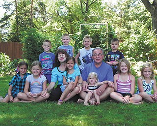 Steve and Beverly Mirich (the parents of two) are the proud grandparents of 10, ages 3 through 10. Five live in town and five live in North Carolina. Each year they gather to visit; this is a picture from this year's get-together: In front, Mealee, 7; Faith, 8; Bubba, as the kids call her, holding Sami, 6; PapPap, as the kids call him, holding the youngest, Tori 3; Abbey, 10; and Isabella, 8. The boys, in back, are Deacon, 4; Joshua, 7; Brady, 5; and Isaac, 4. Each family has 2 boys and 3 girls. Tammy Loew, the Miriches' daughter, submitted the photo.