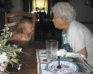 Emily Conner, daughter of Ed and Ann Marie Conner of New Springfield, is receiving grandmotherly advice from her great-grandmother, Anne Kozar of Youngstown. The photo was submitted by Emily's grandparents, Jerry and Ann Marie Hiznay of New Springfield.