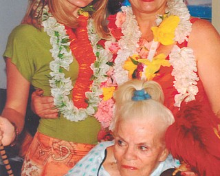 Leanna Hartsough, left, a freshman at YSU, poses with her grandma, Lana Van Auker of Canfield, and great-grandmother, Joanne Speece, when she and Lana performed the hula dance at Blossom Nursing and Rehab Center in Salem.