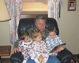 Papa Dedo is shown with three of his six grandchildren, Alan, Sophia and Ross.