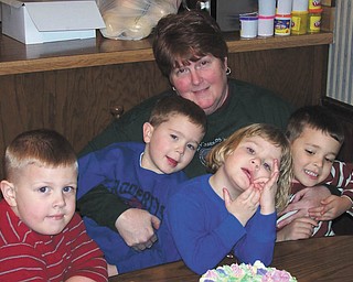 Nana Dedo is holding four of her six grandchlidren, Quinton, Ross, Sophia and Alan.