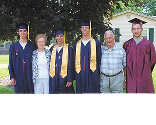 Bev and John Mashiska are pictured with their triplet grandsons, Michael (left), Scott and Jake Miller, who graduated from Austintown Fitch, and another grandson, Eric Yovanovich (right), who graduated from Boardman High School. All four graduated this June. The family says they are the most supportive grandparents ever, attending every football game, track meet, band concert and baseball game that their grandsons participated in. Their family includes another grandson, Dominic Mashiska, an 8th-grader at IHM St. Joseph School, not pictured.