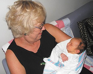Holding her brand-new granddaughter, Leah Lynn Kovacs, is Lynne Challenger Kovacs, both of Youngstown.