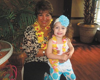 Best pals Ava Valentina Acevedo, 2 1/2, and NaNa Paula Shields, both of Boardman, are enjoying a luau celebration. Ava is the daughter of Toni and Rob Acevedo.