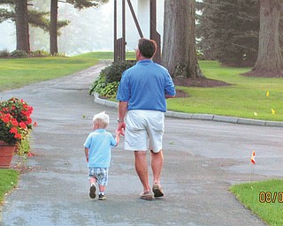Patrick Riley III of Akron goes for a walk with his grandpa, Dr. John Babyak of Canfield.