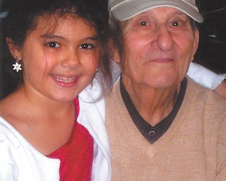 Lindsay Zublena, 8, of Canfield, and Papa Rocco Moderalli like to bake cakes and make deviled eggs together.
