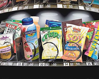 Most vending machines don't offer healthy options but new machines are desinged to offer better choices such as carrot sticks. (Keith Myers/Kansas City Star/MCT)