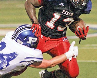 Poland’s Conner Schultheis (24) stops Fitch’s Will Mahone (13) in Friday’s game at Fitch’s Falcon Stadium in Austintown. The Falcons scored on the next play and went on to defeat the Bulldogs, 21-3.