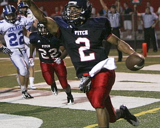ROBERT K. YOSAY | THE VINDICATOR --..Pointing to the crowd Fitchs #2 Demitrous Davis points out the 6 points as he runs into the endzone during second quarter action -..Poland Bulldogs at Fitch Falcons Friday Night Game.--30-..(AP Photo/The Vindicator, Robert K. Yosay)