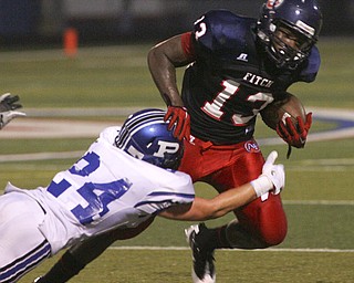 ROBERT K. YOSAY | THE VINDICATOR --..Stopped but still sets up Fitchs first score during second half action as Polands #24 Conner Schultheis stops Fitchs #13 Will Mahone--Poland Bulldogs at Fitch Falcons Friday Night Game.--30-..(AP Photo/The Vindicator, Robert K. Yosay)