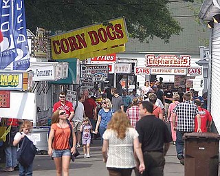 ROBERT K. YOSAY | THE VINDICATOR..Corn Dogs - Elephant Ears and People as the Canfield Fair gets underway for the 165th time...Day one of the Canfield Fair Wednesday Aug 31-.. -30-