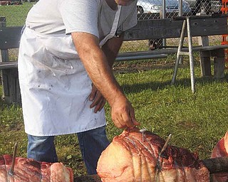 John Byler of Mesopotamia tends to beef for Glenn Christian Church’s 16th annual Ox Roast and Car, Truck and Motorcycle Show. The community event attracts between 2,000 and 3,000 vehicles each year. Parking, admission, food and rides for kids are free, and there are many vendors. Attendees can donate toward the cost of the show. It continues today from 9 a.m. to 10 p.m. at the Trumbull County Fairgrounds, 899 Everett-Hull Road in Bazetta Township.