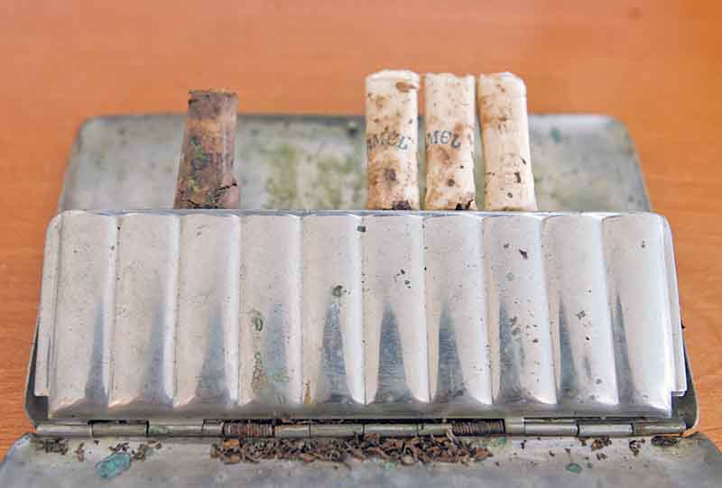 This silver cigarette case was carried in France during World War I by Army doughboy Willis William “Bill” Barris, who has relatives in the Poland and Canfield areas of Ohio and West Middlesex, Pa. The cigarette case, found in an old metal lockbox passed down through several generations of West Middlesex Barris men, contained four of the nonfilter Camel cigarettes doughboy Barris was known to smoke. 

