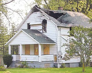 JESSICA M. KANALAS | THE VINDICATOR.3397 Pothour Wheeler Road --Hubbard township home burned two years ago. The township listed 22 properties to demolish. These properties have been foreclosed on and now held by banks, but the banks donÕt want to take care of them... -30-