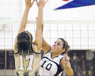 Fitch’s Sam Koniowsky (10) sends the volleyball past Warren Harding’s Christina Bland (17) during Tuesday’s match at Fitch High. The Falcons swept the Raiders.
