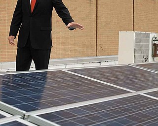 Youngstown State University Engineer Ralph Morrone shows a new solar-panel system on the roof of Moser Hall. YSU officials said Tuesday the system will provide part of the energy needs for the building, saving the university $160,000 over the system’s 25-year life span.