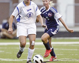 William DLewis The Vindicator Poland's Erin Gabriel, left, and Fitch's Madison Hefner go for the ball during Wed action at Poland.