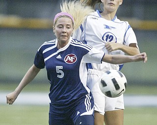 William DLewis The Vindicator Fitch's MAdison Hefner, left, and Poland's Marissa Trevis go for the ball during Wed action at Poland.
