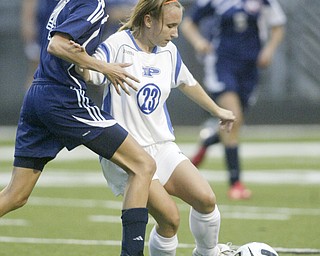 William DLewis The Vindicator Fitch's Krista Martin, left, and Poland's Madison Brooker go for the ball during Wed action at Poland.