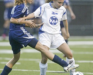 William DLewis The Vindicator Fitch's Krista Martin, left, and Poland's Madison Brooker go for the ball during Wed action at Poland.