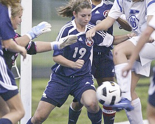 William DLewis The Vindicator Fitch's Lauren Bower #19 , left, and Poland's Maura Bobby go for the ball during Wed action at Poland.