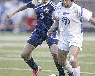 William DLewis The Vindicator Fitch's Madison Hefner, left, and Poland's Erin Gabriel go for the ball during Wed action at Poland.