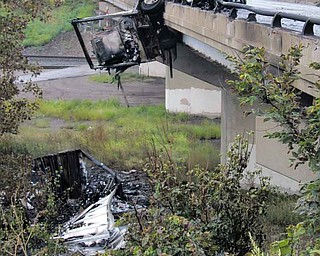 A tractor-trailer accident Wednesday morning sent a portion of the semi over the bridge on Interstate 80 over Mount Everett Road in Hubbard Township. Fire and hazardous-materials crews worked for more than 12 hours to clear the scene, and a portion of I-80 was closed for most of the day.