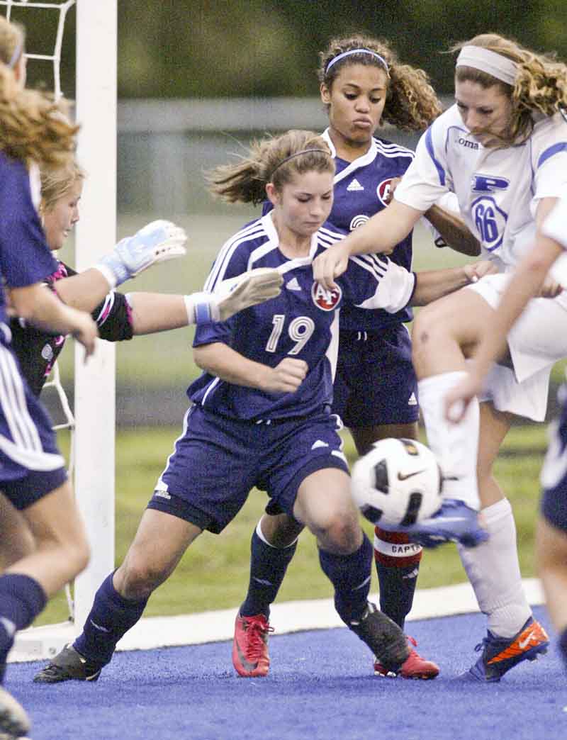 William DLewis  The Vindicator Fitch's Lauren Bower #19 , left, and Poland's Maura Bobby go for the ball during Wed action at Poland.