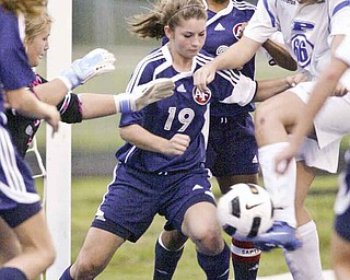 William DLewis The Vindicator Fitch's Lauren Bower #19 , left, and Poland's Maura Bobby go for the ball during Wed action at Poland.