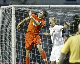 William d Lewis The Vindicator Howland's Connor Gilmour, left, and Chris Pack of Niles go aloft during Thursday action at Niles.