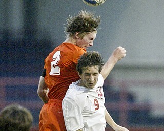 William d Lewis The Vindicator Brad Fields of Howland heads the ball as Niles' Keir MacMillan defends during Thursday action at Niles.