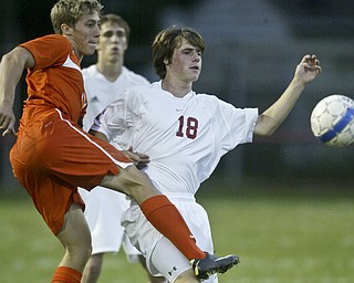 William d Lewis The Vindicator Howland's Connor Sherin, left, and Tyler Hinton of Niles go for the ball during Thursday action at Niles.