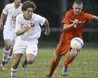 William d Lewis The Vindicator NilesCJ Cicero, left, and Connor Gilmour, left, and Kyle Watson of Howland go for the ball during Thursday action at Niles.