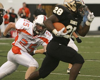 ROBERT K. YOSAY | THE VINDICATOR --..Foot Race as Warrens #28 ( NO NAME) takes off after a kick as #25 Howland Anthony Yassal eyes him to the sidelines .. - Howland Tigers vs Warren G Harding Raiders @ Warren ..--30-..(AP Photo/The Vindicator, Robert K. Yosay)