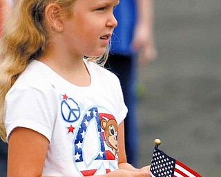 Stadium Drive third-grader Savannah White listened to the Boardman High School marching band as it played a medley of patriotic songs Friday.