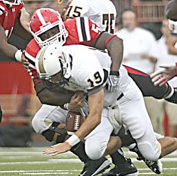ROBERT K. YOSAY | THE VINDICATOR..YSU #52 Aronde Stanton crushes Valpos QB Eric Hoffman causing Hoffman to cough up the ball but he also recovered the fumble during second quarter action.-30