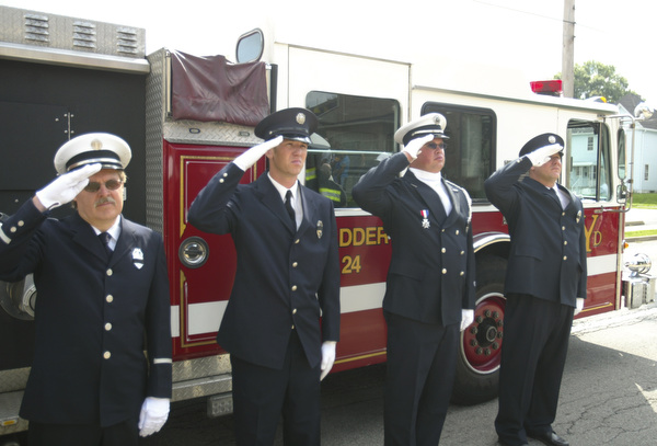 ROBERT  K.  YOSAY  | THE VINDICATOR --..Youngstown Fire Fighters salute as taps were played  l-r   Captain Ed Fay, Jeff Kaschak, Lt Be Szamara  and Carl Farina -..Solemn Service as St Patricks Church in Youngstown, commemerated 9-11 with a prayer, pledge of allegiance, a moment of silence and a flag to Bazetta fire dept by Rep Tim Ryan - the beam from the WTC was then touched by parioshners in a quiet solemn moment..--30-..(AP Photo/The Vindicator, Robert K. Yosay)