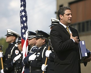 ROBERT  K.  YOSAY  | THE VINDICATOR --..Congressman Tim Ryan leads parioshners in the pledge of allegiance ..Solemn Service as St Patricks Church in Youngstown, commemorated 9-11 with a prayer, pledge of allegiance, a moment of silence and a flag to Bazetta fire dept by Rep Tim Ryan - the beam from the WTC was then touched by parioshners in a quiet solemn moment..--30-..(AP Photo/The Vindicator, Robert K. Yosay)