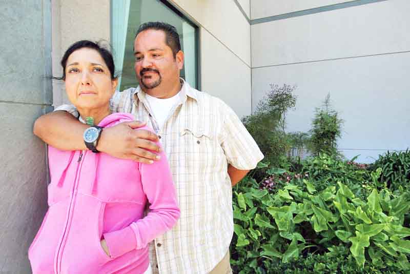 Heart transplant patient Andrea Ybarra and her husband Moises stand outside the UCLA Hospital in Westwood, California, on July 28, 2011. The hosptial is experimenting wiht a new heart transplant procedure that keeps the heart beating outside the body using a mechanical device instead of the traditional ice method to preserve the organ in transit. (Genaro Molina/Los Angeles Times/MCT).