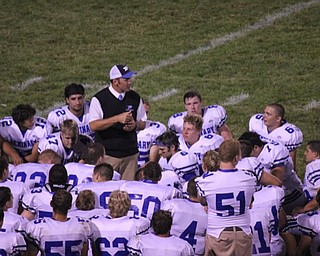 Attached is a picture of Coach Mark Brungard talking to his Poland Bulldogs after a hard fought battle versus the Hubbard Eagles on Opening Night, August 25, 2011. Coach was sporting a sweater vest and tie in honor of his former coach and mentor, Jim Tressel. Brungard was the quarterback who helped lead Tressel's YSU Penguins to National Titles in 1993 and 1994.